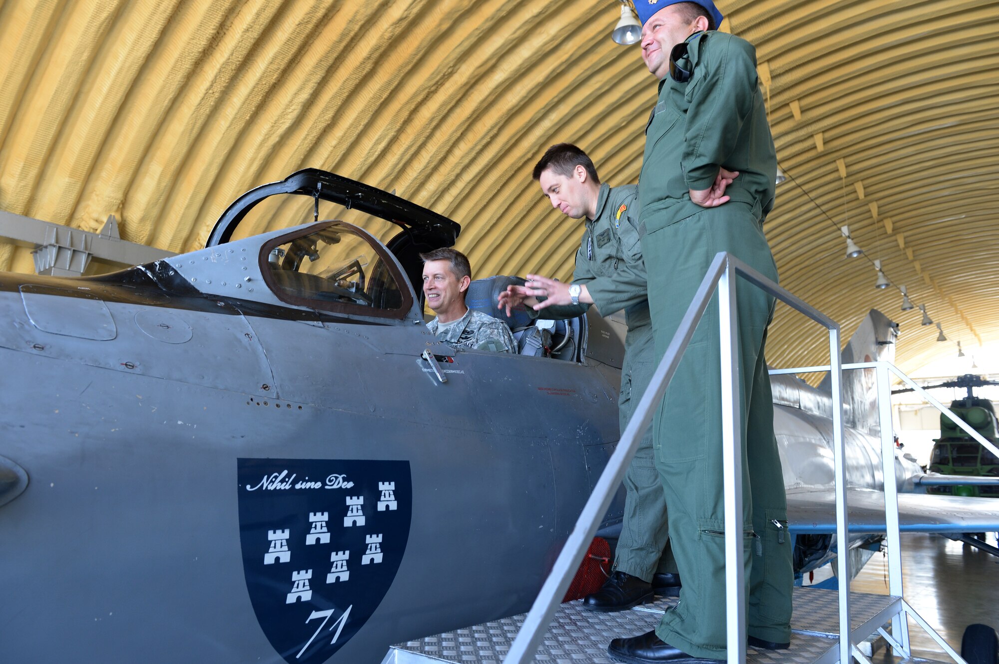 U.S. National Guard Maj. Gen. Daniel Hokanson, Oregon National Guard Adjutant General, sits in the cockpit of a Romanian MIG-21 fighter aircraft during a base tour at Campia Turzii, Romania, July 22 2015. Hokanson visited the 123rd Expeditionary Fighter Squadron during their theater security package deployment to Campia Turzii. The visit allowed Hokanson to pass along information from home, answer questions and learn more about their mission in Romania. (U.S. Air Force Senior Airman Dylan Nuckolls/Released)