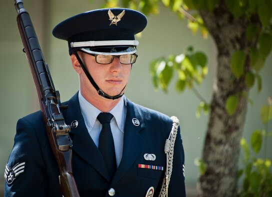 Senior Airman Ryan Aponte leads in the flag detail element during an Honor Guard graduation ceremony June 15 at Eglin Air Force Base, Fla. Approximately 12 new Airmen graduated from the 80-plus-hour course. The graduation performance includes flag detail, rifle volley, pall bearers and bugler for friends, family and unit commanders. (U.S. Air Force photo/Samuel King Jr.)
