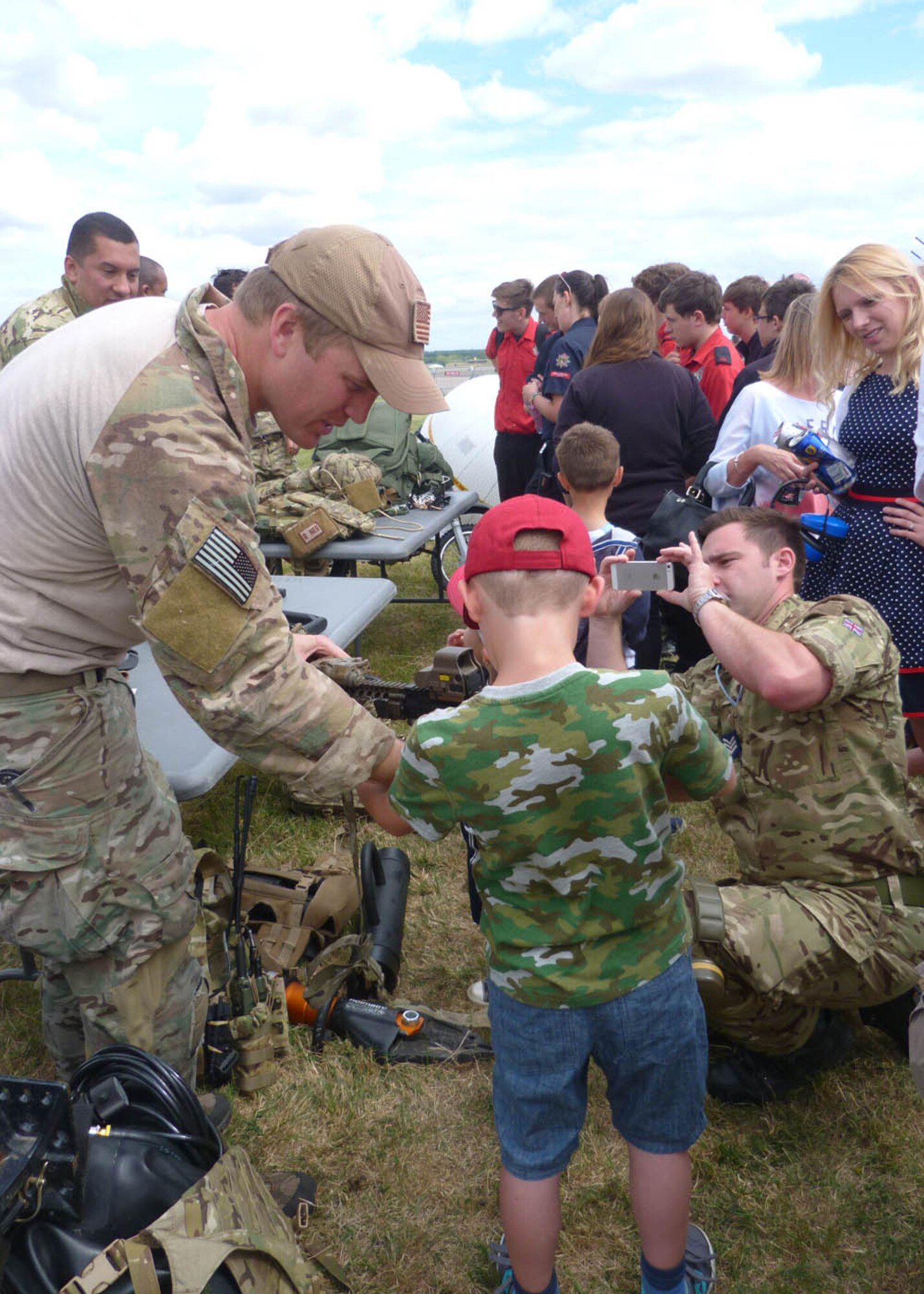 U.S. Airmen from the 352nd Special Operations Wing demonstrated the tools of their trade at the “Family and Friends” open day July 23, 2015, on RAF Marham, Norfolk, England. Team Mildenhall members from the 352nd SOW, 100th Security Forces Squadron, 100th Logistics Readiness Squadron and 100th Aircraft Maintenance Squadron partnered with the Royal Air Force at the event, providing demonstrations, aircraft statics and a food booth. (U.S. Air Force photo by Karen Abeyasekere/Released)