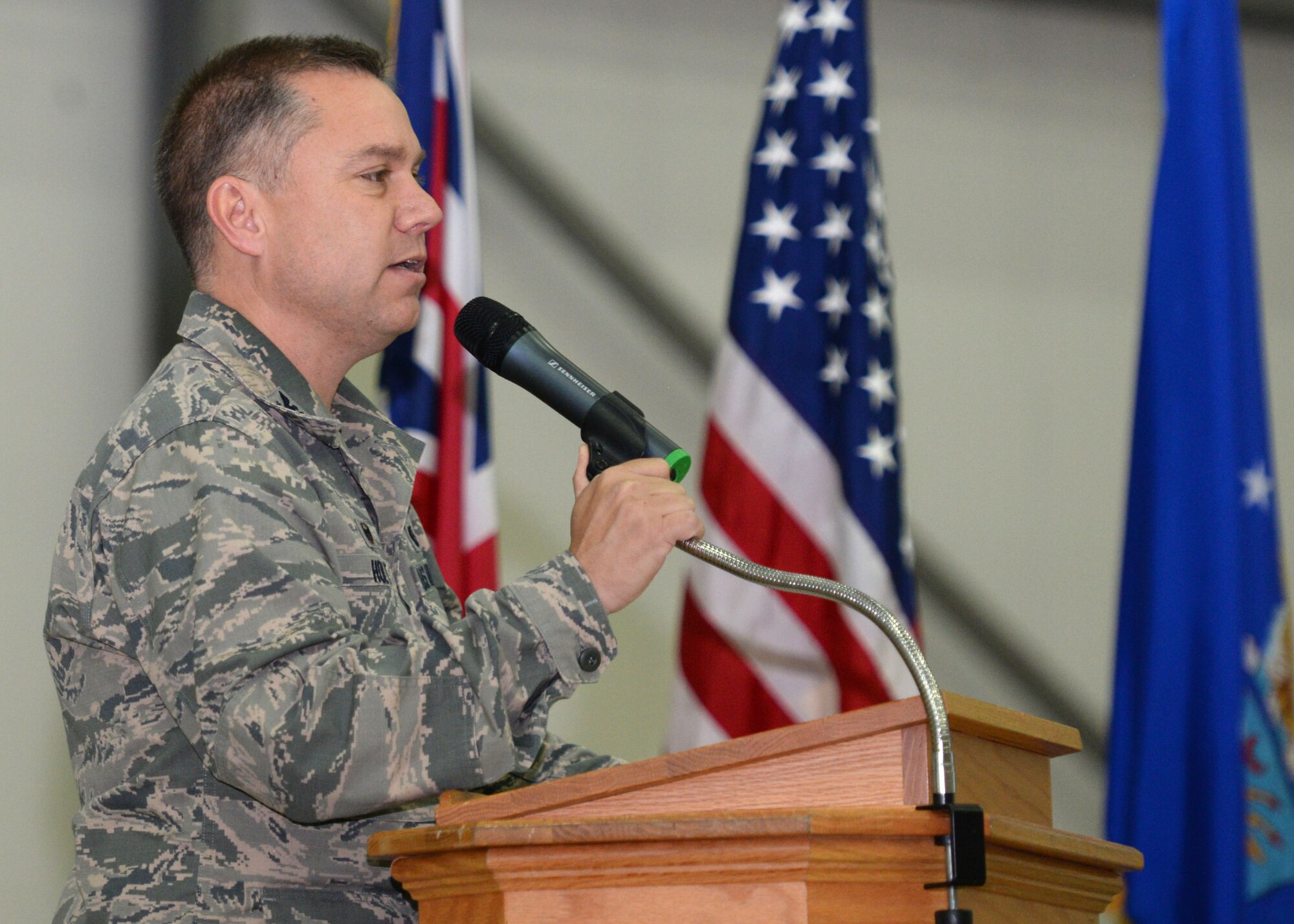 U.S. Air Force Col. William Holt, 352nd Special Operations Wing commander, introduces U.S. Air Force Maj. Gen. Gregory J. Lengyel, U.S. Special Operations Command - Europe commander, and U.S. Navy Command Master Chief Petty Officer Andrew Harrison, SOCEUR senior enlisted leader, during an all hands call July 23, 2015, on RAF Mildenhall, England. Lengyel and Harrison visited RAF Mildenhall to meet with service members to inform them what they do for the mission. (U.S. Air Force photo by Gina Randall/Released)