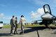 U.S. Air Force Brig. Gen Joel A. Clark, 158th Fighter Wing assistant adjutant general, and Chief Master Sgt. Brian J. Marchessault, 158th FW command chief, talk with Technical Sgt. Christopher Guay 158th FW avionics technician, about the F-16 Fighting Falcon he maintains during a visit to Kadena Air Base, Japan, July 23, 2015. Members from the 158th FW of the Vermont Air National Guard are currently deployed to Kadena as part of a routine theater security package to solidify the relationship between the U.S., international partners and allies in the Asia-Indo-Pacific region. (U.S. Air Force photo by Airman 1st Class Zackary A. Henry)