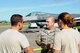 U.S. Air Force Brig. Gen. Joel A. Clark, 158th Fighter Wing assistant adjutant general, speaks to Senior Airman Ryan Bowles, 158th FW aerospace propulsion technician, and Senior Airman Morgan Rollins, 158th FW crew chief, during his visit to Kadena Air Base, Japan, July 23, 2015. Members of the Vermont Air National Guard, also known as the Green Mountain Boys, are currently deployed to Kadena to enhance regional security in the Indo-Asia-Pacific region and demonstrate the U.S. commitment to stability. (U.S. Air Force photo by Airman 1st Class Zackary A. Henry)
