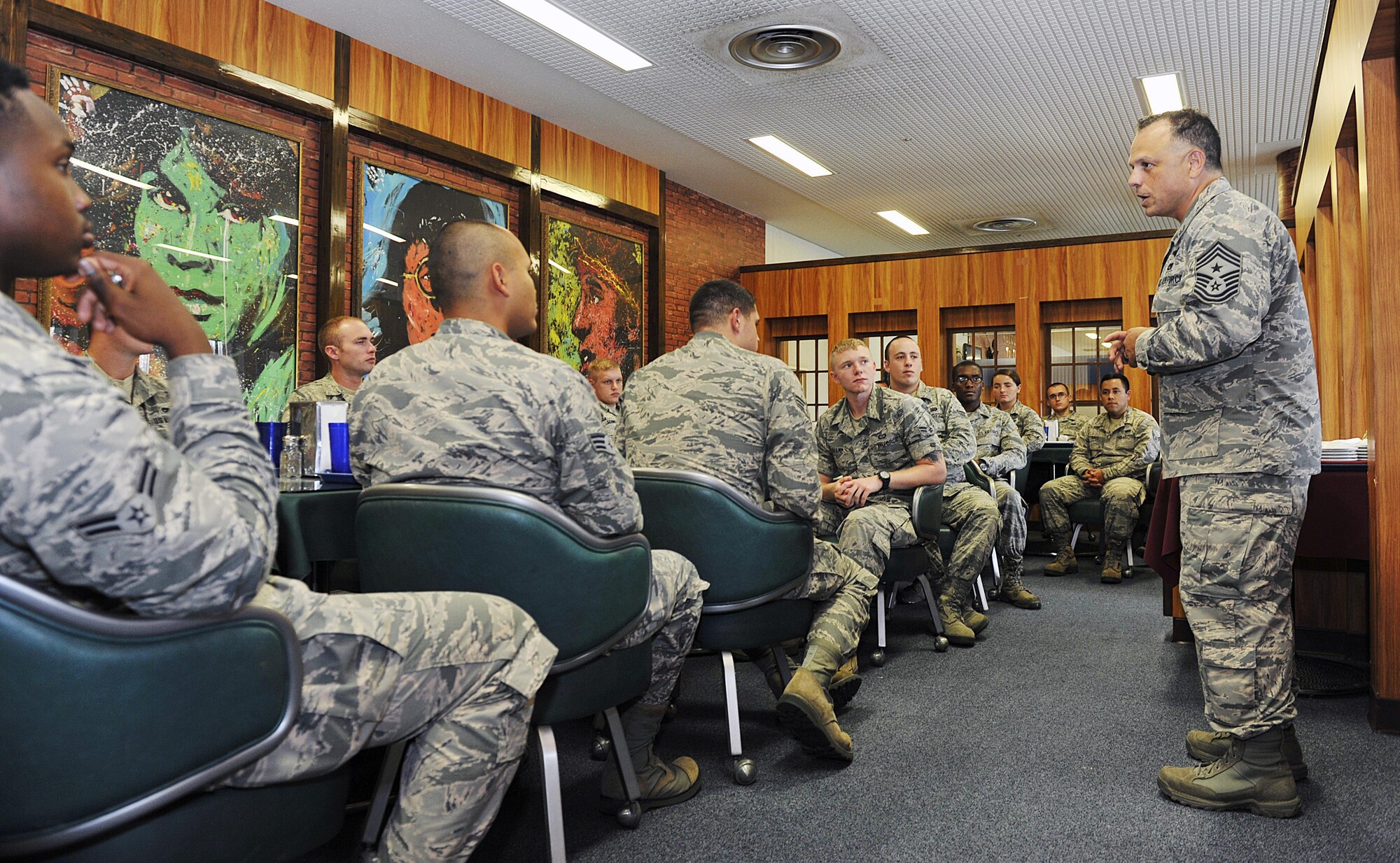 U.S. Air Force Chief Master Sgt Matthew Caruso, Air Force Special Operations Command command chief, speaks to 353rd Special Operations Group Airmen at the Marshall Dining Facility during his visit to Kadena Air Base, Japan, July 21, 2015. The purpose of his visit is to observe 353rd SOG facilities and capabilities and meet with the Airmen to hear their concern, opinion and questions. Caruso answered questions and offered to help make changes that would improve the everyday lives and operations of the Airmen. (U.S. Air Force photo by Naoto Anazawa)