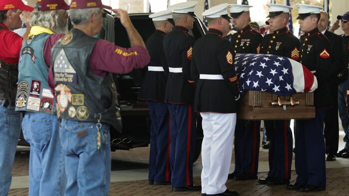 Marines carry Lance Cpl. Skip Wells’ casket into the First Baptist Church of Woodstock July 26, 2015 in Woodstock, Georgia. Wells was one of five service members killed during the shooting at the Naval Operational Support Center and Marine Corps Reserve Center on July 16, 2015. Hundreds of people were present at the service showing their respect and support for Wells, his family and friends.