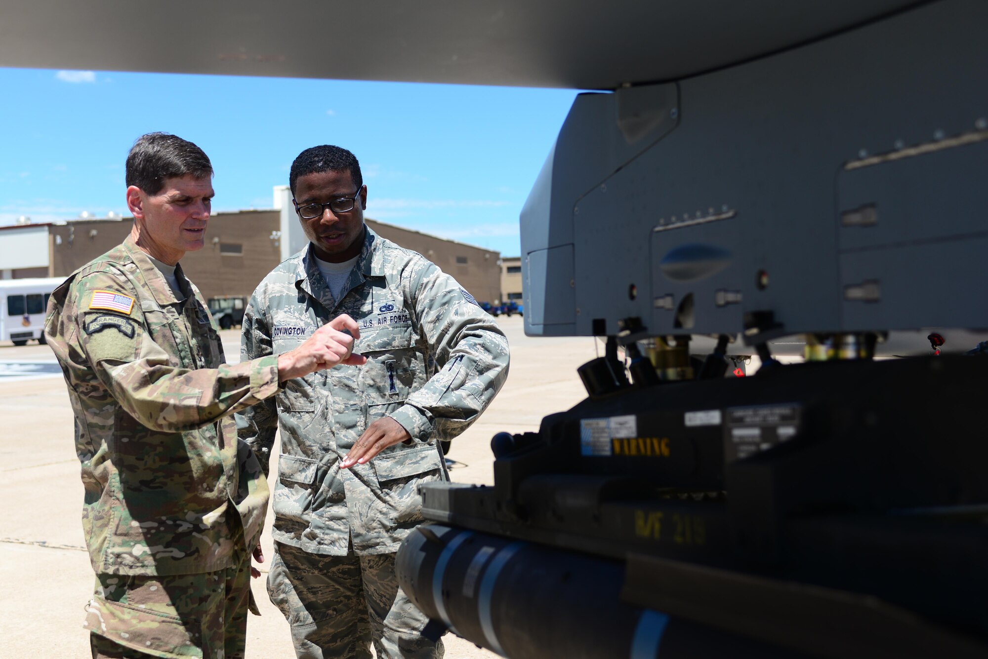 U.S. Army Gen. Joseph L. Votel, Commander U.S. Special Operations Command, receives a capabilities brief from Staff Sgt. Jeante Covington, 27th Special Operations Maintenance Group, July 22, 2015 at Cannon Air Force Base, N.M. During his visit to Cannon, Votel received briefings from subject matter experts attached to various aerial assets, conversed with personnel and recent award winners, conducted a base-wide all call, and witnessed a 26th Special Tactics Squadron demonstration. (U.S. Air Force photo/ Senior Airman Eboni Reece)