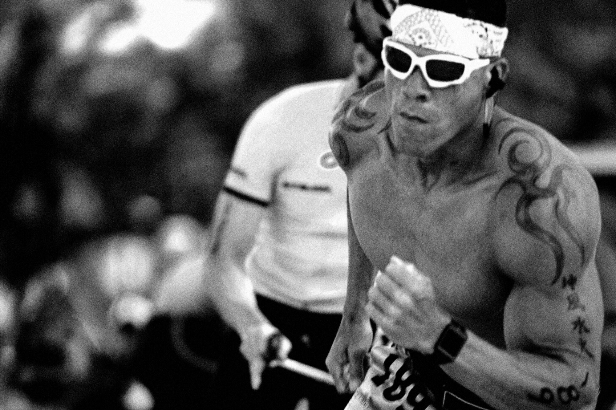 U.S. Marine Corps Staff Sgt. Jeffrey Velazquez, Marine Corps Detachment, begins the running portion of the 8th Annual Goodfellow Triathlon after tagging out with his cycling teammate at the Goodfellow Air Force Base Recreation Camp in San Angelo, Texas, July 25, 2015. Their team went on to win the male team category. (U.S. Air Force photo by Tech. Sgt. Austin Knox/Released) 