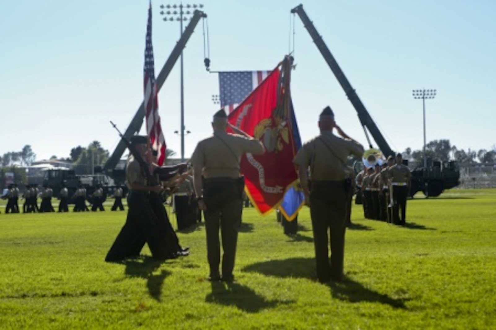 U.S. Marine Maj. General Vincent A. Coglinese, 1st Marine Logistics Group (1st MLG), and Brig. Gen. David A Ottignon render honors to colors during the pass in review of the 1st Marine Logistics Group Change of Command Ceremony aboard Camp Pendleton, Calif., July 24, 2015. The Change of Command for 1st MLG showcased the passing of command from Maj. Gen. Vincent A. Coglinese to Brig. Gen. David a Ottignon. (U.S. Marine Corps photo by Lance Cpl. Lauren Falk/Released)
