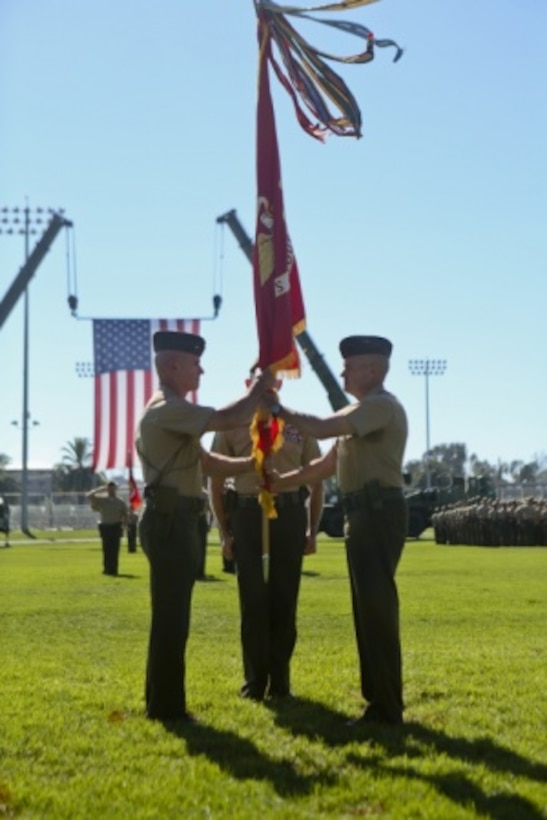 U.S. Marine Maj. General Vincent A. Coglinese, 1st Marine Logistics Group (1st MLG), passes the Group Colors to Brig. Gen. David A Ottignon during the 1st Marine Logistics Group Change of Command Ceremony aboard Camp Pendleton, Calif., July 24, 2015. The Change of Command for 1st MLG showcased the passing of command from Maj. Gen. Vincent A. Coglinese to Brig. Gen. David a Ottignon. (U.S. Marine Corps photo by Lance Cpl. Lauren Falk/Released)