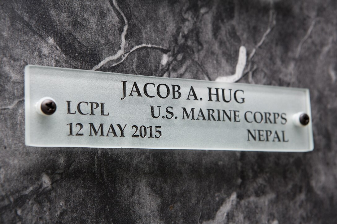 A name placard for U.S. Marine Corps Lance Cpl. Jacob A. Hug hangs on a wall in the Hall of Heroes at the Defense Information School on Fort George G. Meade, Md., July 27, 2015. U.S. Marine Corps Cpl. Sara A. Medina and Lance Cpl. Jacob A. Hug, combat photographers, were killed during earthquake relief operations in Nepal, May 12, 2015. (DoD photo by Shane Keller/Released)