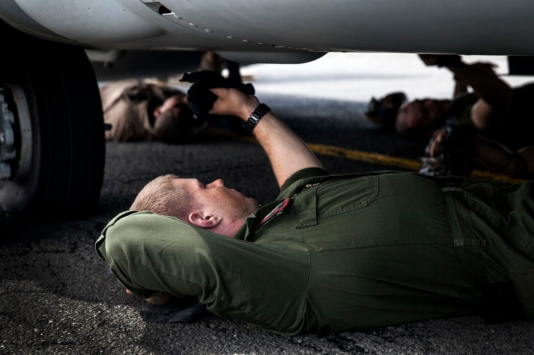 NAIROBI, Kenya (July 20, 2015) U.S. Marines with the “Greyhawks” of Marine Medium Tiltrotor Squadron 161 (Reinforced), 15th Marine Expeditionary Unit, clean the undercarriage of an MV-22B Osprey. The Marines are in Kenya to support President Barrack Obama’s upcoming visit.. The “Greyhawks” are the aviation combat element of the 15th MEU which is embarked aboard the Essex Amphibious Ready Group and deployed to maintain regional security in the U.S. 6th Fleet area of operations. (U.S. Marine Corps photo by Cpl. Elize McKelvey/Released)