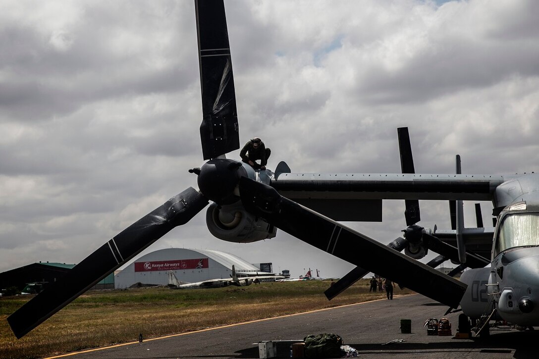 NAIROBI, Kenya (July 20, 2015) A U.S. Marine with the “Greyhawks” of Marine Medium Tiltrotor Squadron 161 (Reinforced), 15th Marine Expeditionary Unit, performs maintenance on the engine of an MV-22B Osprey. The Marines are in Kenya to support President Barrack Obama’s upcoming visit. The “Greyhawks” are the aviation combat element of the 15th MEU which is embarked on the Essex Amphibious Ready Group and deployed to maintain regional security in the U.S. 6th Fleet area of operations. (U.S. Marine Corps photo by Cpl. Elize McKelvey/ Released)