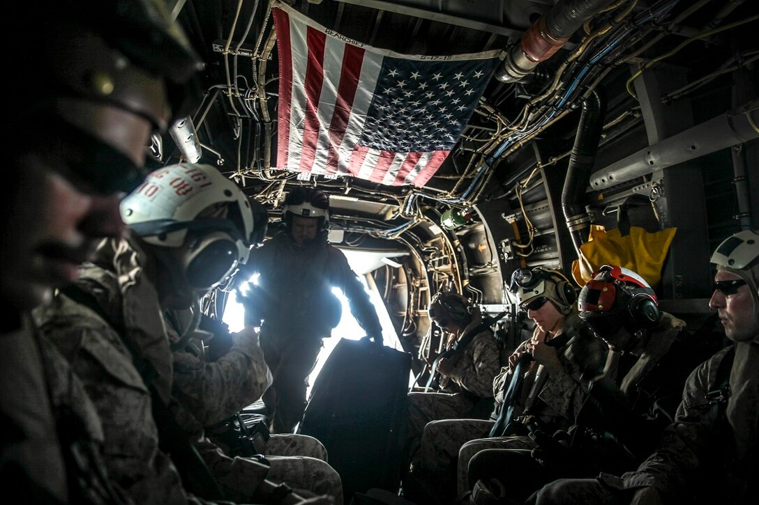 INDIAN OCEAN (July 19, 2015) U.S. Marines with the 15th Marine Expeditionary Unit load gear onto an MV-22B Osprey before departing from the amphibious assault ship USS Essex (LHD 2). The Marines are flying to Kenya in support of President Barrack Obama’s visit to Kenya.   Elements of the 15th MEU, based out of Camp Pendleton, Calif., and embarked aboard the Essex, are conducting naval operations in 6th Fleet areas of operation in support of U.S. national security interests in Europe and Africa.  (U.S. Marine Corps photo by Cpl. Elize McKelvey/Released)