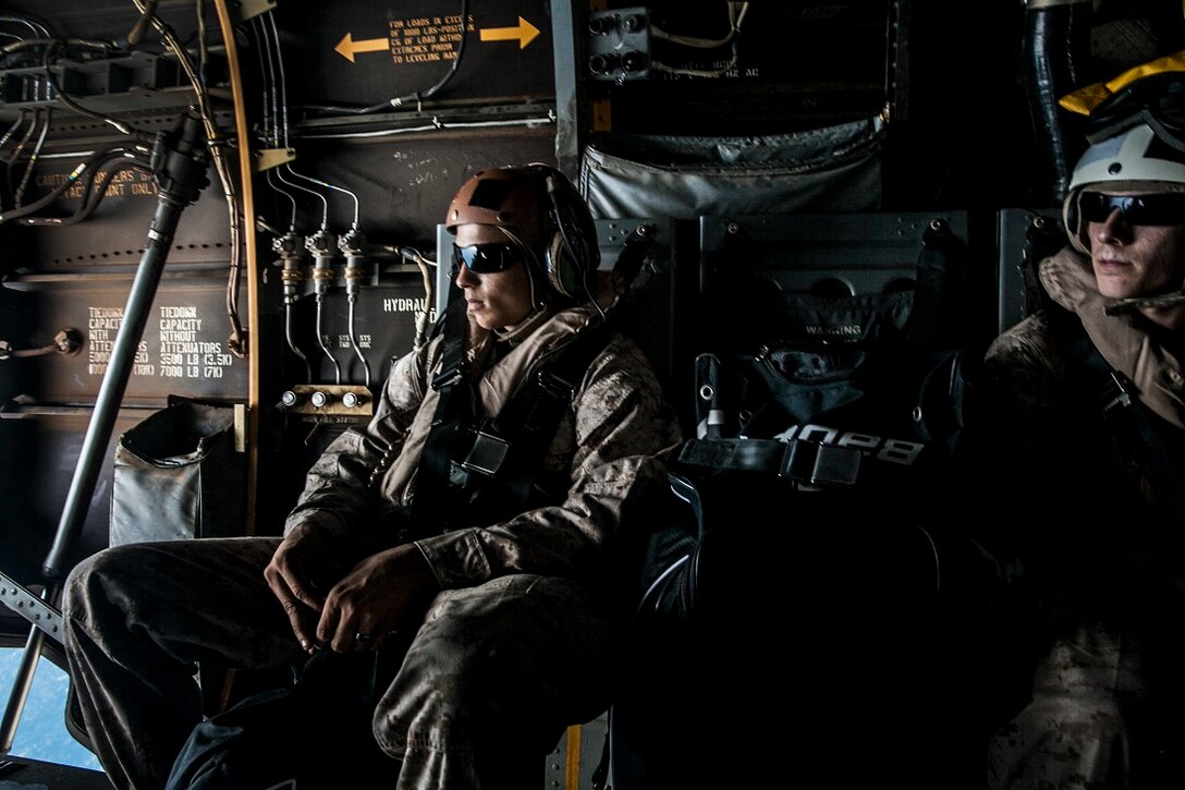 INDIAN OCEAN (July 19, 2015) U.S. Marines with the 15th Marine Expeditionary Unit look at the landscape from an MV-22B Osprey. The Marines are heading to Kenya in support of President Barrack Obama’s visit to South Africa. The 15th MEU is embarked on the Essex Amphibious Ready Group and deployed to maintain regional security in the U.S. 6th Fleet area of operations. Elements of the 15th MEU, based out of Camp Pendleton, Calif., and embarked aboard the Essex, are conducting naval operations in 6th Fleet areas of operation in support of U.S. national security interests in Europe and Africa.  (U.S. Marine Corps photo by Cpl. Elize McKelvey/ Released)