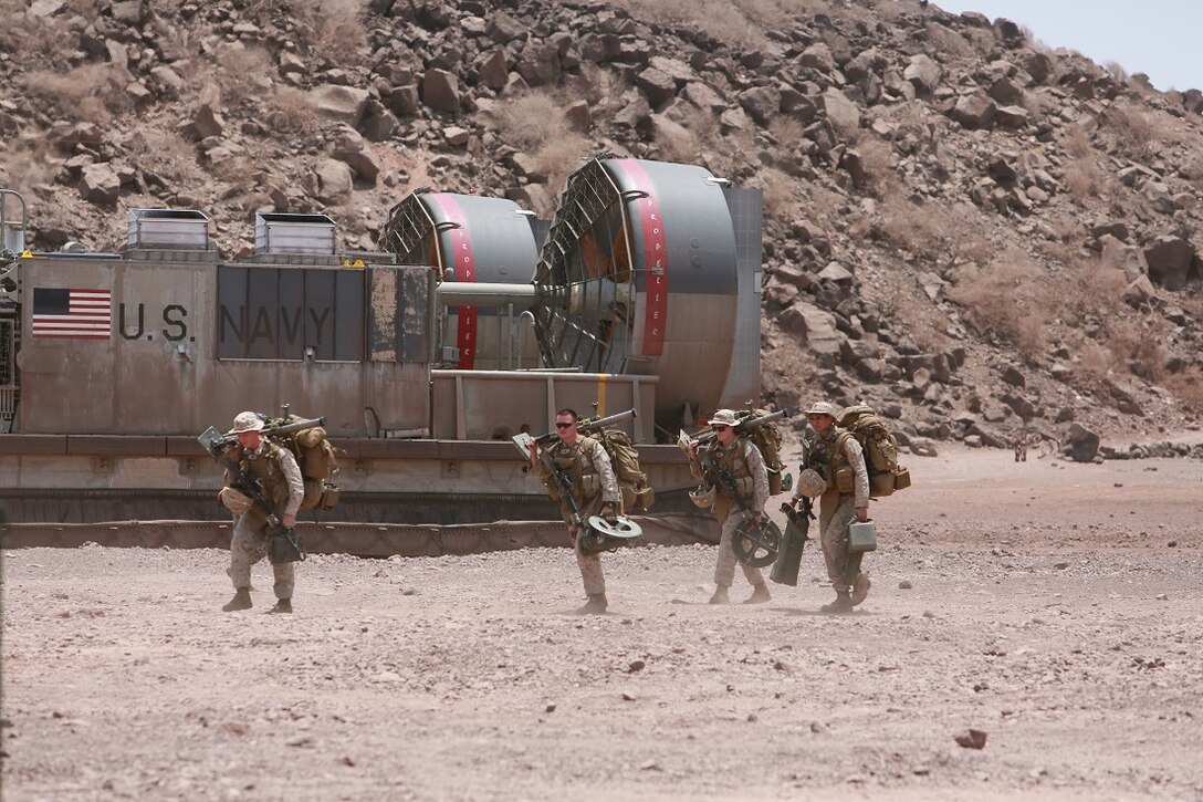 ARTA BEACH, DJIBOUTI (July 21, 2015) U.S. Marines off-load mortars from a landing craft, air cushion on Arta Beach. Elements of the 15th Marine Expeditionary Unit came ashore in Djibouti to conduct sustainment training in order to ensure that they are prepared to respond to any tasking during their deployment. The 15th MEU is currently deployed conducting maritime security operations in the 5th and 6th Fleet areas of responsibility. (U.S. Marine Corps photo by Sgt. Steve H. Lopez/Released)