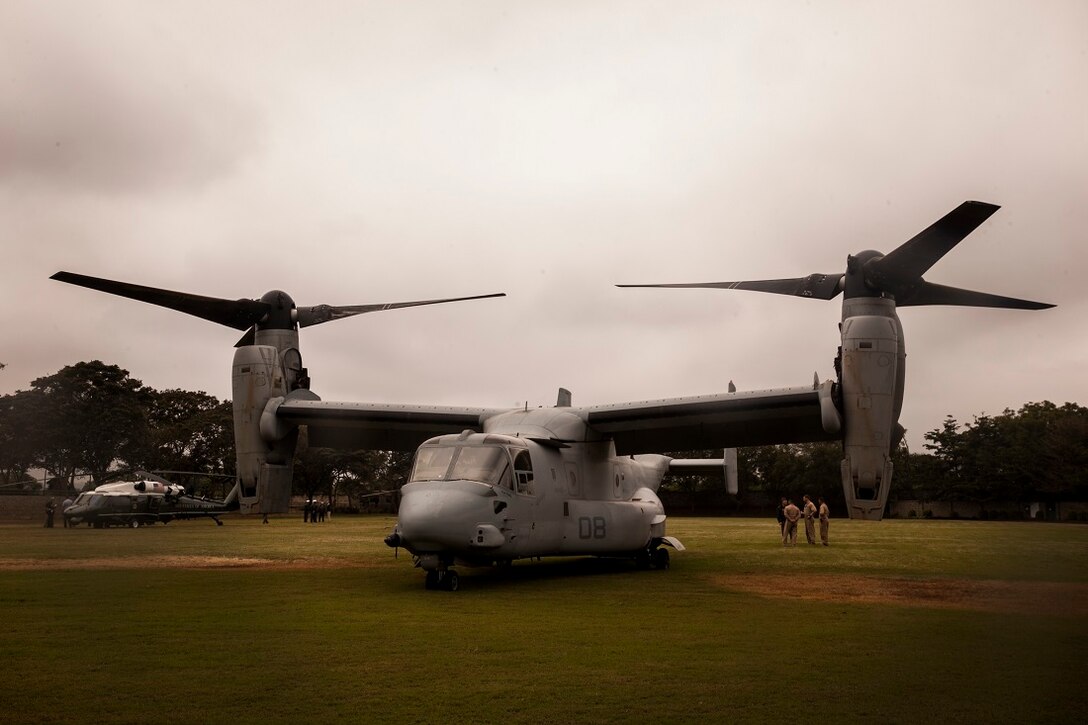 NAIROBI, Kenya (July 25, 2015) An MV-22B Osprey with the “Greyhawks” of Marine Medium Tiltrotor Squadron 161 (Reinforced), 15th Marine Expeditionary Unit (MEU), stages near an aircraft from Marine Helicopter Squadron One (HMX-1) after helping transport personnel during President Obama’s visit to Nairobi July 25, 2015. Elements of the 15th MEU, based out of Camp Pendleton, California, and embarked aboard the Essex, are conducting naval operations in the 6th Fleet areas of operation in support of U.S. national security interests in Europe and Africa. (U.S. Marine Corps photo by Cpl. Elize McKelvey/Released)