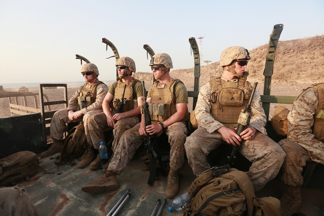 ARTA BEACH, Djibouti (July 22, 2015) U.S. Marines with Combat Logistics Battalion 15, 15 Marine Expeditionary Unit, ride in a convoy to a machine-gun range near Arta Beach, Djibouti. Elements of the 15th Marine Expeditionary Unit are ashore in Djibouti for sustainment training to maintain and enhance the skills they developed during their pre-deployment training period. The 15th MEU is currently deployed in support of maritime security operations and theater security cooperation efforts in the U.S. 5th and 6th Fleet areas of operation. (U.S. Marine Corps photo by Sgt. Steve H. Lopez/Released)