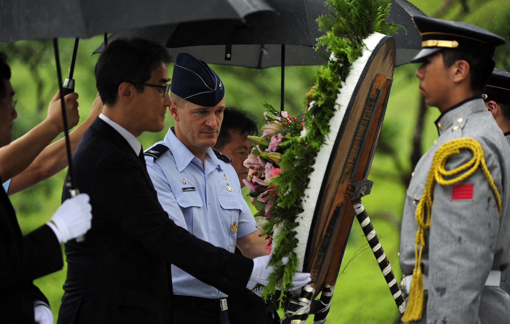 KUNSAN AIR BASE, Republic of Korea (July 24, 2015) - Mr. Yi Byong-goo, Regional director of the Ministry of Patriots and Veterans Affairs (MPVA), Gwangju, lays a wreath with Col Seth Frank, 8th Fighter Wing Mission Support Group Commander, at the start of a Korean Armistice Agreement anniversary ceremony at Imsil National Cemetery. The MPVA invited the 8th Fighter Wing to participate in the event as representatives of the U.S. military. 