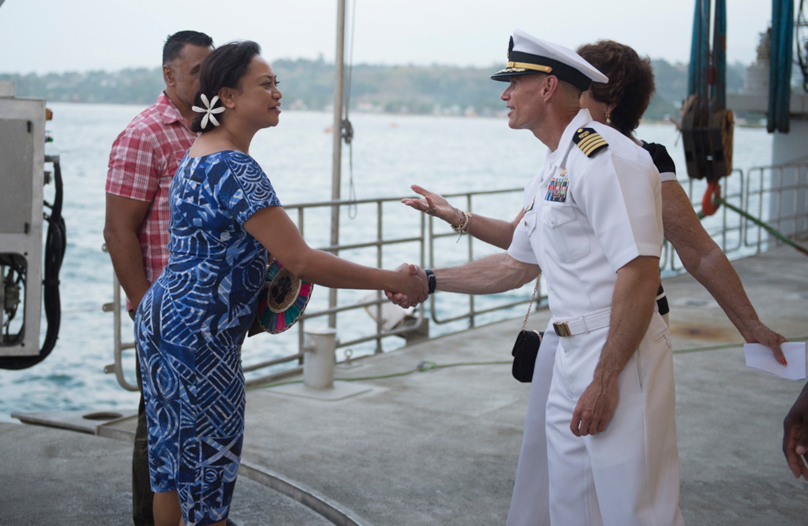 HONIARA, Guadalcanal (July 24, 2015) - Commodore, Task Force Forager Capt. James Meyer welcomes a representative from the local government to the closing reception of Pacific Partnership. Task Force Forager, embarked aboard the Military Sealift Command joint high speed vessel USNS Millinocket (JHSV 3) is serving as the secondary platform for Pacific Partnership, led by an expeditionary command element from the Navy's 30th Naval Construction Regiment (30 NCR) from Port Hueneme, Calif. Now in its 10th iteration, Pacific Partnership is the largest annual multilateral humanitarian assistance and disaster relief preparedness mission conducted in the Indo-Asia Pacific region. While training for crisis conditions, Pacific Partnership, missions have provided medical care to approximately 270,000 patients and veterinary service to more than 38,000 animals. 