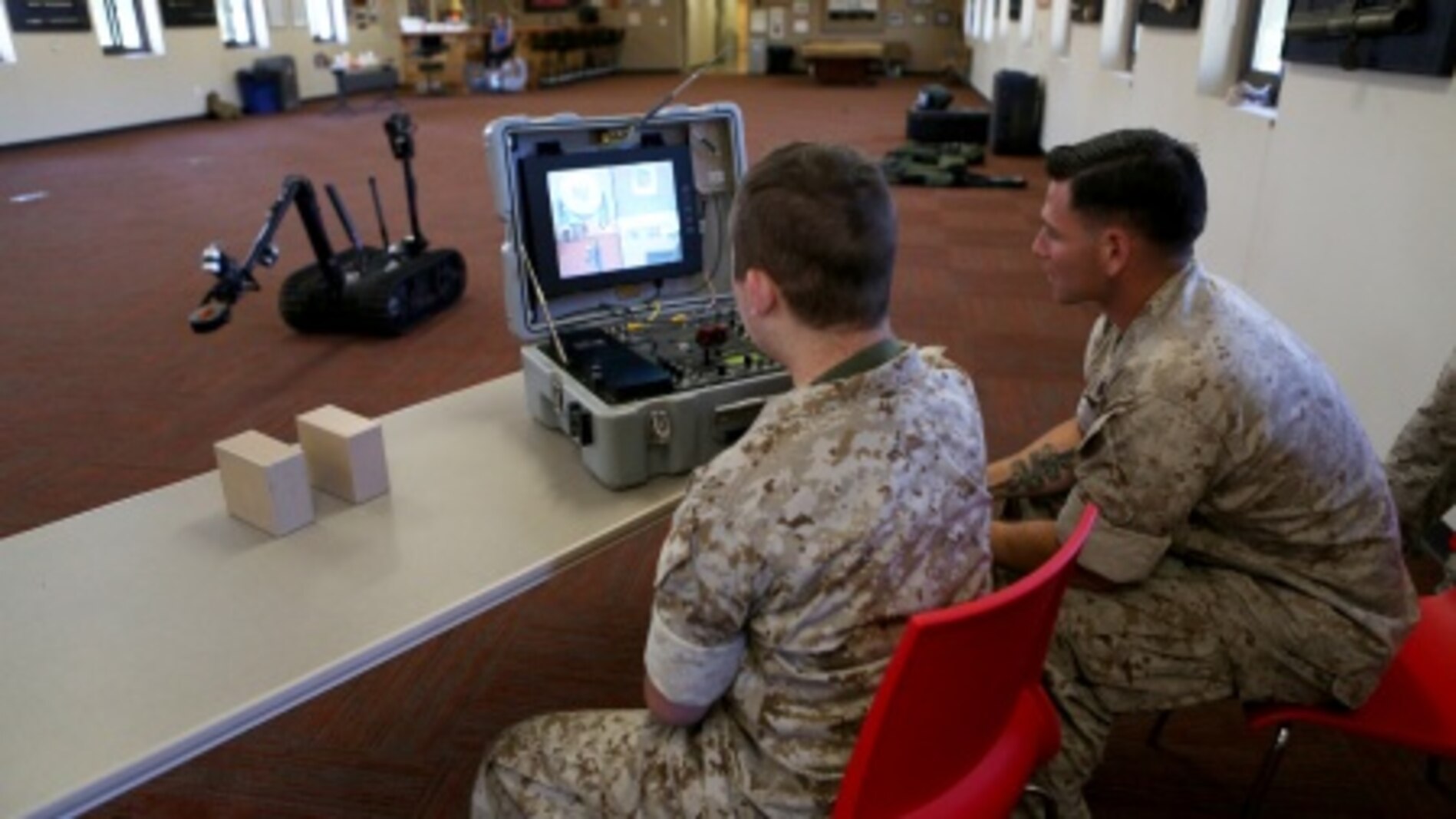 James Gallant, a young man diagnosed with brain cancer, operates the TALON Explosive Ordnance Disposal robot with Marines of 1st EOD Company, 1st Marine Logistics Group, aboard Camp Pendleton, Calif., July 25, 2015. Collaborating with the Make-A-Wish Foundation, 1st EOD helped James experience what being an EOD technician is like by giving him a tour through their library of ordnance and EOD tools, teaching him to operate the TALON bomb disposing robot and presenting him with his own desert utilities and EOD badge.
