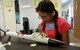 Ava Hernandez, a student at DoD STARBASE-Kelly, Joint Base San Antonio, Texas focuses on putting the finishing touches on her model rocket July 17, 2015. The DoD STARBASE-Kelly program is sponsored by the 433rd Airlift Wing. (U.S. Air Force photo/Tech. Sgt. Carlos J. Trevino)
