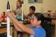 Victoria Villareal, daughter of Master Sgt. Arnold Villareal, 433 Aircraft Maintenance Squadron, attaches a decals to her rocket on the final morning of a week long class at DoD STARBASE-Kelly, Joint Base San Antonio-Lackland,Texas, July 17, 2015. Victoria, along with 19 other students, successfully launched rockets later on that morning. (U.S. Air Force photo/Tech. Sgt. Carlos J. Trevino) 
