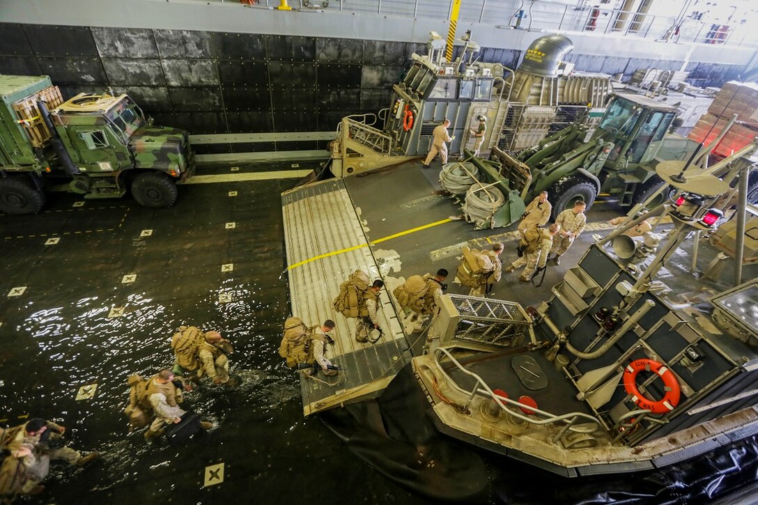 ARABIAN SEA (July 20, 2015)  U.S. Marines with Battalion Landing Team 3rd Battalion, 1st Marine Regiment, 15th Marine Expeditionary Unit, board a landing craft, air cushion aboard the amphibious transport dock ship USS Anchorage (LPD 23).  Marines and sailors disembarked the Anchorage to conduct training in Djibouti.  BLT 3/1 is the ground combat element of the 15th MEU, is conducting training ashore in Djibouti to maintain the skills they developed during their pre-deployment training cycle and ensure they are prepared to support regional security while deployed to the U.S. 5th Fleet area of operations. (U.S. Marine Corps photo by Sgt. Jamean Berry/Released)