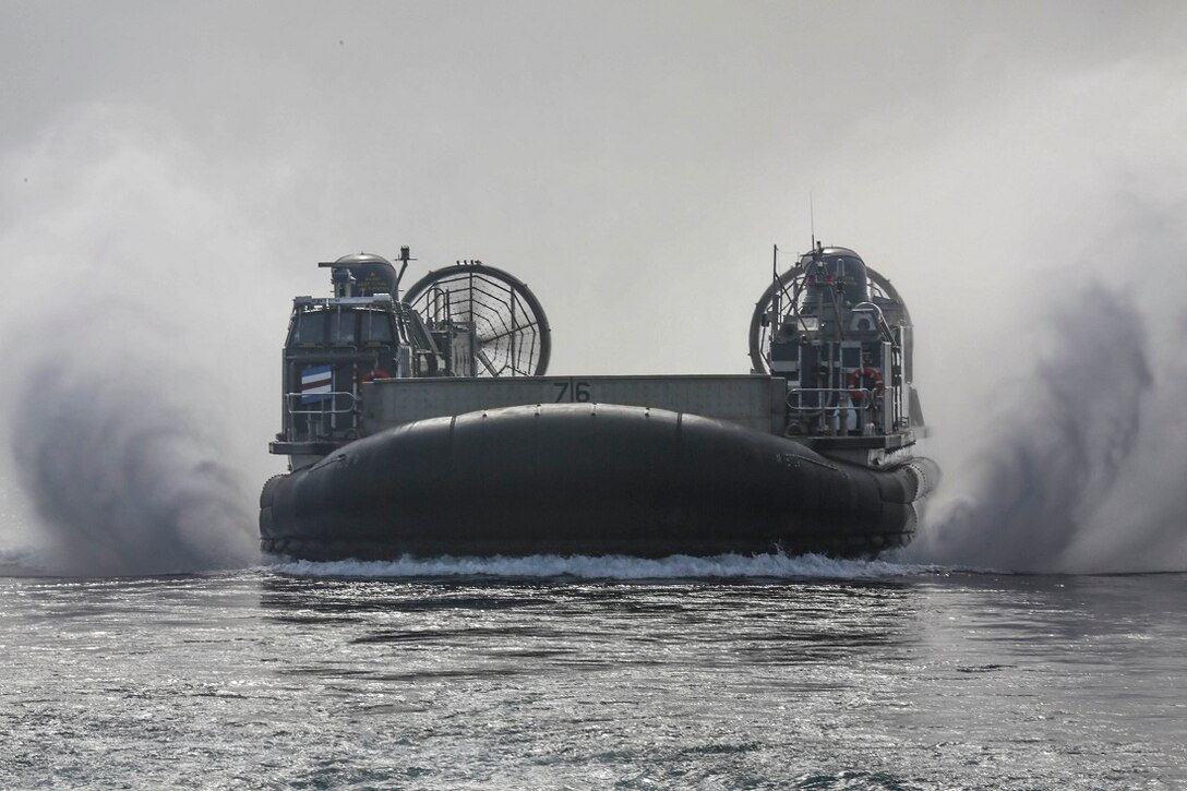 ARABIAN SEA (July 20, 2015)  Landing craft, air cushion 76 with Assault Craft Unit 5, 15th Marine Expeditionary Unit, approaches the amphibious transport dock ship USS Anchorage (LPD 23).  Elements of the 15th Marine Expeditionary Unit are conducting training ashore in Djibouti to maintain the skills they developed during their pre-deployment training cycle and ensure they are prepared to support regional security while deployed to the U.S. 5th Fleet area of operations. (U.S. Marine Corps photo by Sgt. Jamean Berry/Released)