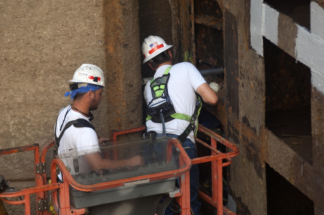 Gary Fleeman (Right) and Ty Melton, lock and dam equipment mechanics assigned to the U.S. Army Corps of Engineers Nashville District, inspect the lower gate July 27, 2015 at Old Hickory Lock in Old Hickory, Tenn. Fleeman is normally assigned to Ft. Loudoun Lock on the Tennessee River.  Melton is normally assigned to the Tennessee River Operations Center.  Old Hickory Lock is empty of water until Aug. 4, 2015 while maintenance crews inspect the lock chamber and perform scheduled maintenance.  The lock is located on the Cumberland River at mile 216.2.