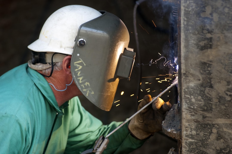 Danny Tanner, a lock and dam equipment mechanic assigned to the Cumberland River Operations Center in the U.S. Army Corps of Engineers Nashville District, welds the lower gate July 27, 2015 at Old Hickory Lock in Old Hickory, Tenn.  The lock is empty of water until Aug. 4, 2015 while maintenance crews inspect the lock chamber and perform scheduled maintenance.  The lock is located on the Cumberland River at mile 216.2.