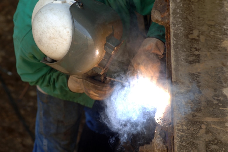 Danny Tanner, a lock and dam equipment mechanic assigned to the Cumberland River Operations Center in the U.S. Army Corps of Engineers Nashville District, welds the lower gate July 27, 2015 at Old Hickory Lock in Old Hickory, Tenn.  The lock is empty of water until Aug. 4, 2015 while maintenance crews inspect the lock chamber and perform scheduled maintenance.  The lock is located on the Cumberland River at mile 216.2.