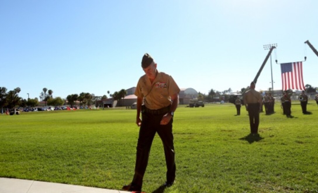 Major Gen. Vincent A. Coglianese walks away after relinquishing command of 1st Marine Logistics Group to Brig. Gen. David A. Ottignon during the 1st MLG Change of Command Ceremony aboard Camp Pendleton, Calif., July 24, 2015. The ceremony included the passing of the 1st MLG colors, remarks from the incoming and outgoing commanders, performances by the 1st Marine Division Band, a C-130 flyover and static displays depicting the various aspects of the MLG.
