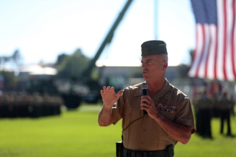 Marine Brig. Gen. David A Ottignon 1st Marine Logistics Group (1st MLG) speaks to Marines, Sailors, family, and friends who attended during the 1st Marine Logistics Group Change of Command Ceremony aboard Camp Pendleton, Calif., July 24, 2015. The Change of Command for 1st MLG showcased the passing of command from Maj. Gen. Vincent A. Coglinese to Brig. Gen. David a Ottignon. (U.S. Marine Corps photo by Lance Cpl. Lauren Falk/Released)