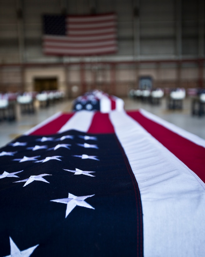 The remains of U.S. Marines who had fallen during World War II at the Battle of Tarawa rest in an aircraft hangar on Joint Base Pearl Harbor/Hickam after a Dignified Transfer Ceremony July 26, 2015. During the ceremony, the remains of approximately 36 U.S. Marines were returned to American soil. (U.S. Marine Corps photo by Sgt. William Holdaway/RELEASED)