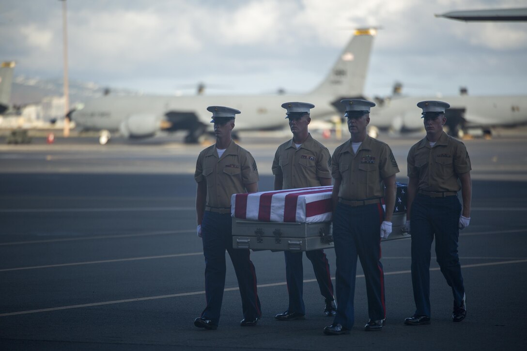 Third Marine Regiment Marines carry a casket holding the remains of one of 36 Marines, July 26, 2015 during a dignified transfer ceremony at Hangar 35 aboard Joint Base Pearl Harbor-Hickam, Hawaii. The remains of 36 Marines who fought and died during the Battle of Tarawa in World War II were discovered and returned to the U.S. for proper identification and final burial. (U.S. Marine Corps photo by Cpl. Matthew J. Bragg)