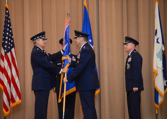 Gen. Robin Rand accepts the Air Force Global Strike Command flag from Air Force Chief of Staff Gen. Mark A. Welsh III during a change of command ceremony at Barksdale Air Force Base, La., July 28, 2015. The Air Force elevated AFGSC to a four-star major command to provide its nuclear deterrence and global strike missions with the highest level of leadership oversight similar to the service’s other core operational missions. (U.S. Air Force photo/Senior Airman Jannelle Dickey)
