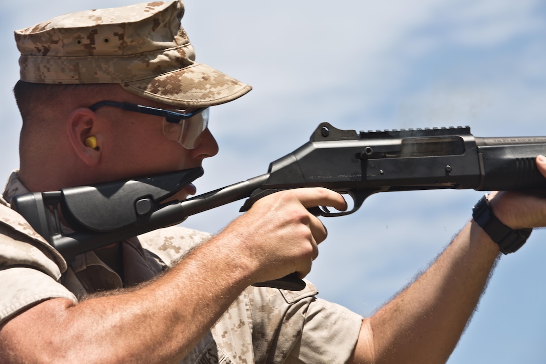 Lance Cpl. William Hickman, an accident investigator with the Provost Marshal’s Office, sights down his M1014 shotgun during a practice shoot for the practical weapons course, July 22, 2015, at Kaneohe Bay Range Training Facility, Hawaii. During the practice, shooters fired from the standing, kneeling and hip-fire position with the shotgun. The 140-acre range provides facilities for small arms marksmanship training, qualification, and requalification.  In addition to Marine Corps Base Hawaii Marines, the range is used by members of the Department of Defense, local law enforcement, and federal organizations. The mission of MCB Hawaii is to provide facilities, programs and services in direct support of units, individuals and families to enhance and sustain combat readiness for all operating forces and tenant organizations aboard the installation. 