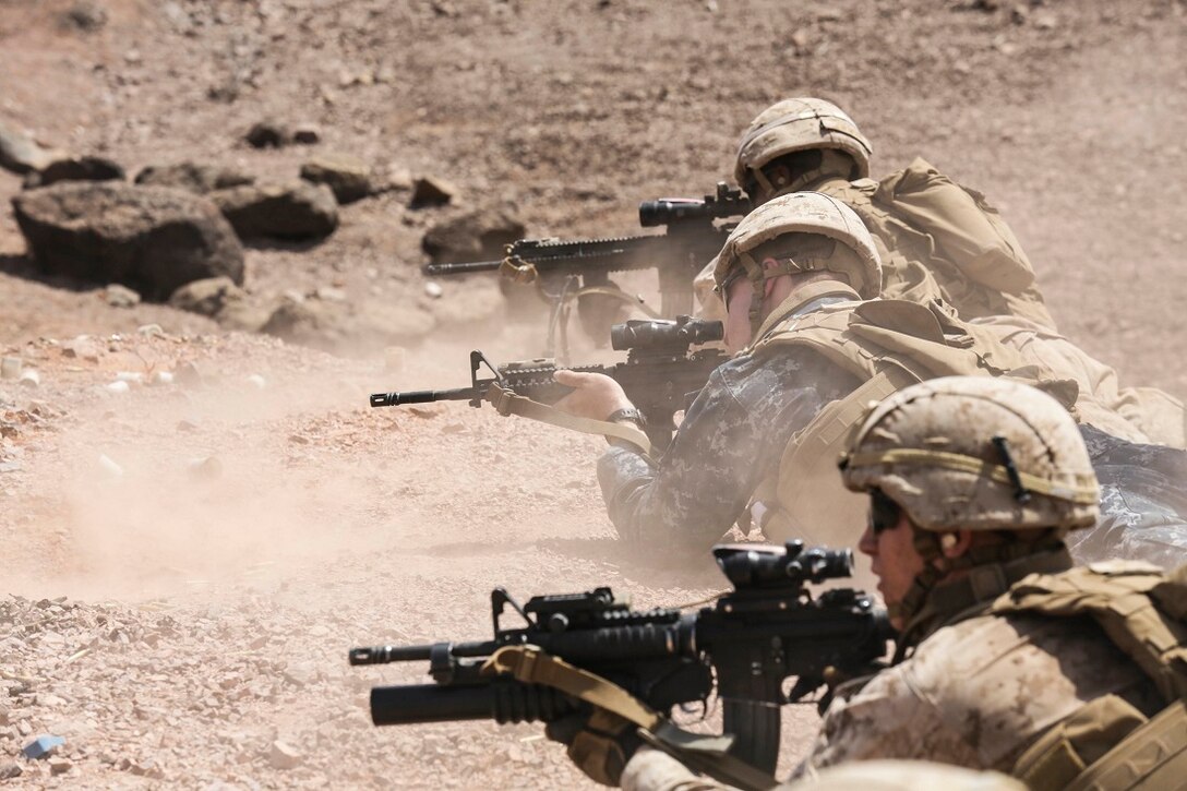 U.S. Marines and U.S. Navy Sailors with Battalion Landing Team 3rd Battalion, 1st Marine Regiment, 15th Marine Expeditionary Unit and the USS Anchorage, fire their weapons during a squad-attack exerciseat Arta Beach, Djibouti July 22, 2015.  The Marines of BLT 3/1 executed a series of attack and maneuver drills consisting of, machine gun, squad and night attacks.  Elements of the 15th Marine Expeditionary Unit are ashore in Djibouti for sustainment training to maintain and enhance the skills they developed during their pre-deployment training period.  The 15th MEU is currently deployed in support of maritime security operations and theater security cooperation efforts in the U.S. 5th and 6th Fleet areas of operation. 