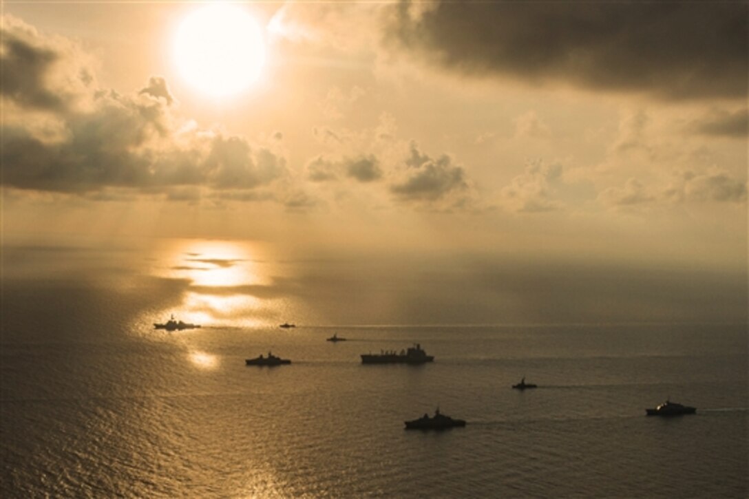 U.S. and Singapore navy ships and submarines gather in formation during the underway phase of Cooperation Afloat Readiness and Training (CARAT) Singapore 2015 in the South China Sea, July 21, 2015. CARAT is an annual exercise series involving the U.S. Navy, the U.S. Marine Corps and the armed forces of nine partner nations.