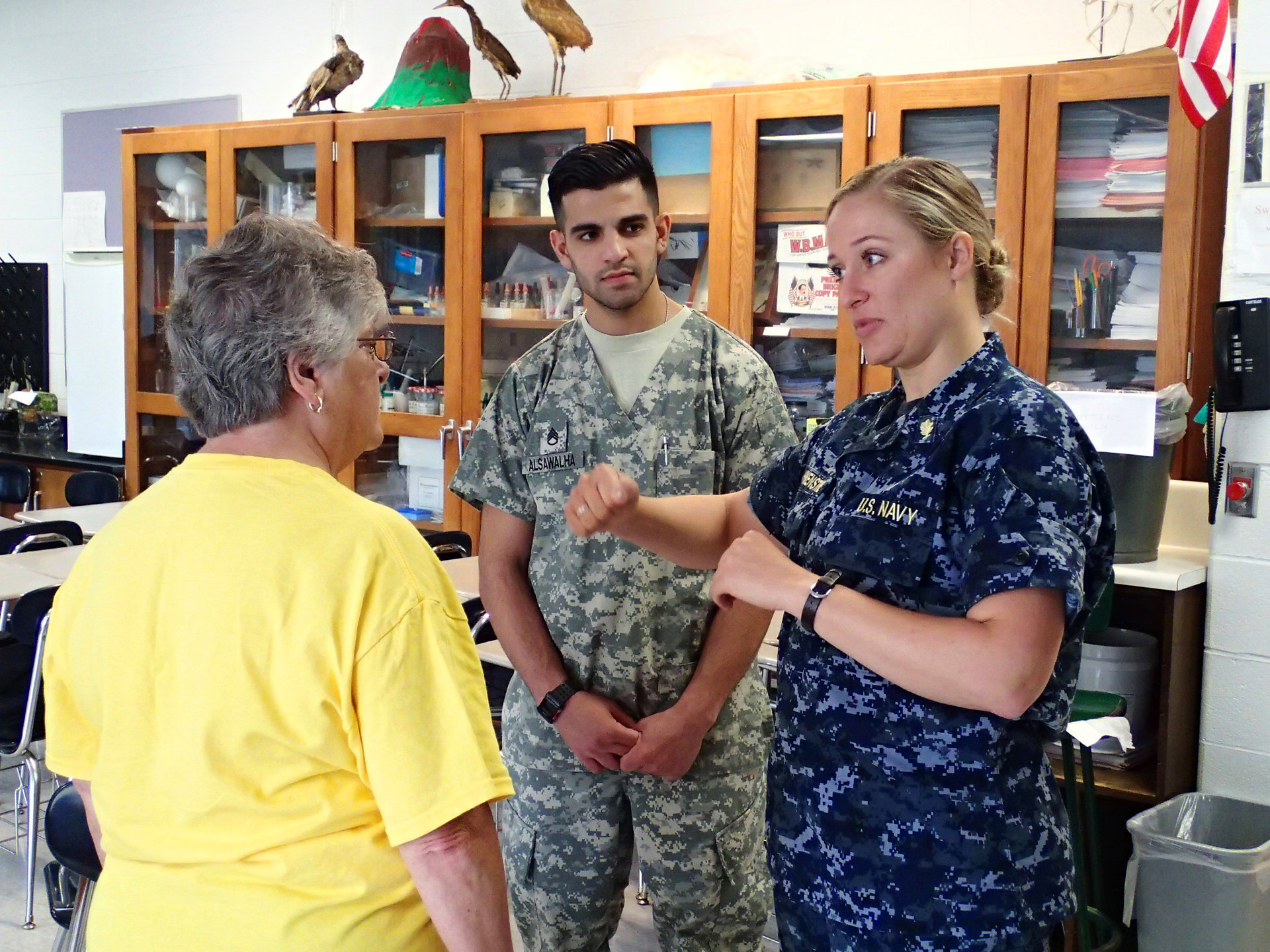 Navy Lt. Katelyn Howenstine, right, and Army Staff Sgt. Musab Alsawalha