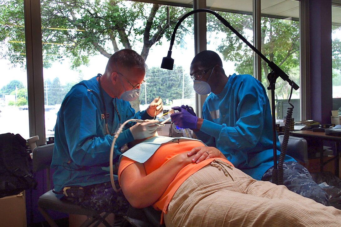 Marine Corps Lt. Stewart Whiddon, left, and Navy Reserve Petty Officer 3rd Class Levy Pierre