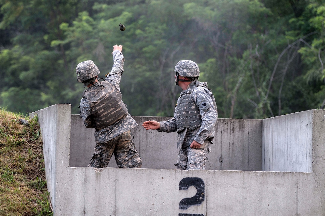 New cadets throw live grenades at targets as part of a live-fire training exercise at the U.S. Military Academy at West Point, N.Y., July, 27, 2015.