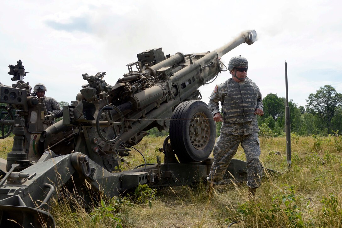 Army Gen. Frank Grass, chief of the National Guard Bureau, fires an M777 155 mm howitzer during Northern Strike 2015 at Camp Grayling, Mich., July 26, 2015.