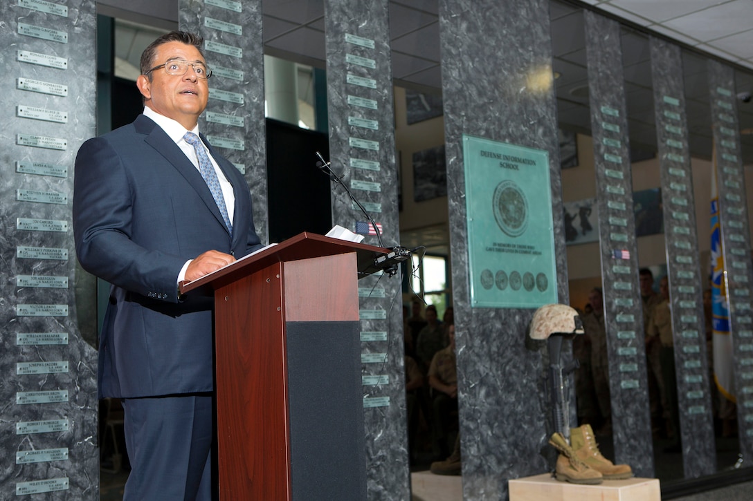 Retired Marine Corps Maj. Michael Lujan gives a eulogy for Cpl. Sara A. Medina during a memorial service and Defense Information School Hall of Heroes induction ceremony on Fort George G. Meade, Md., July 27, 2015. Lujan is director of Combat Camera on Marine Corps Base Quantico, Va.