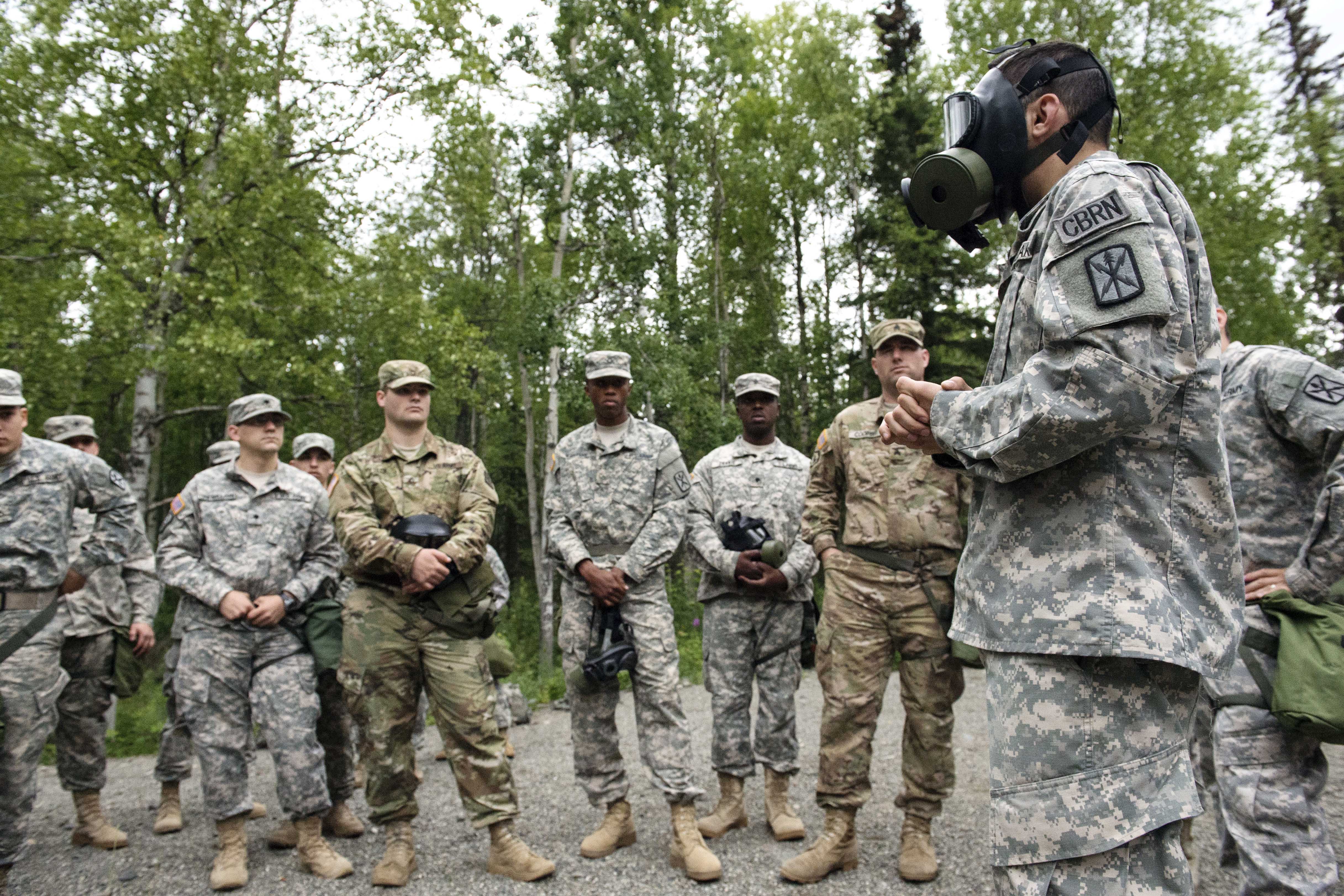 Army Spc. Jose O. Incleramos, right, gives a safety brief to fellow