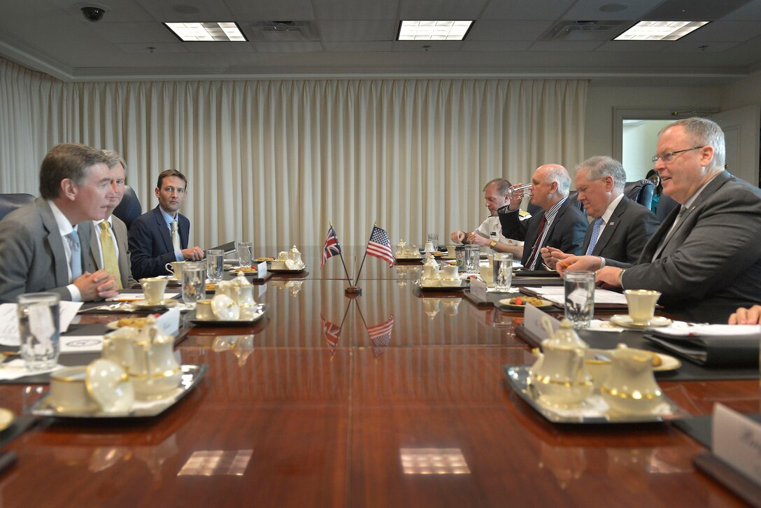 U.S. Deputy Defense Secretary Bob Work, right, meets with Philip Dunne, left, British defense procurement minister, at the Pentagon, July 28, 2015.