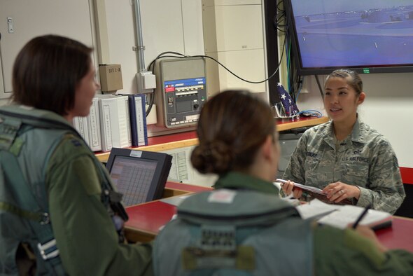U.S. Air Force Staff Sgt. Marie Nicolas, 13th Fighter Squadron assistant NCO in charge of squadron aviation resource management, verifies training requirements of pilots prior to them flying at Misawa Air Base, Japan, July 27, 2015. Part of Nicolas' duties includes conducting go and no-go checks on pilots' training to make sure they meet all requirements prior to flying. (U.S. Air Force photo by Senior Airman Jose L. Hernandez-Domitilo)