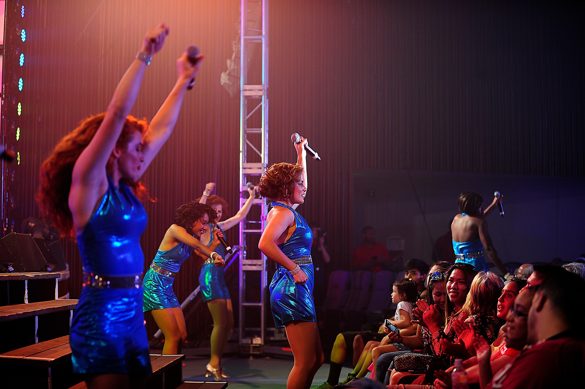 Tops in Blue members perform for the crowd at the Keystone Theater on Kadena Air Base, Japan, July 22, 2015. Tops in Blue serves as an expeditionary entertainment unit tasked with providing quality entertainment for the worldwide Air Force family. This year’s performance, “Freedom’s Song,” is being performed for service members and their families throughout the United States as well as 20 countries worldwide. (U.S. Air Force photo by Airman 1st Class Corey Pettis) 