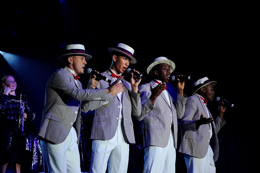 Performers from Tops in Blue sing to the crowd at the Keystone Theater on Kadena Air Base, Japan, July 22, 2015. Tops in Blue serves as an expeditionary entertainment unit tasked with providing quality entertainment for the worldwide Air Force family. This year’s performance, “Freedom’s Song,” is being performed for service members and their families throughout the United States as well as 20 countries worldwide. (U.S. Air Force photo by Airman 1st Class Corey Pettis) 