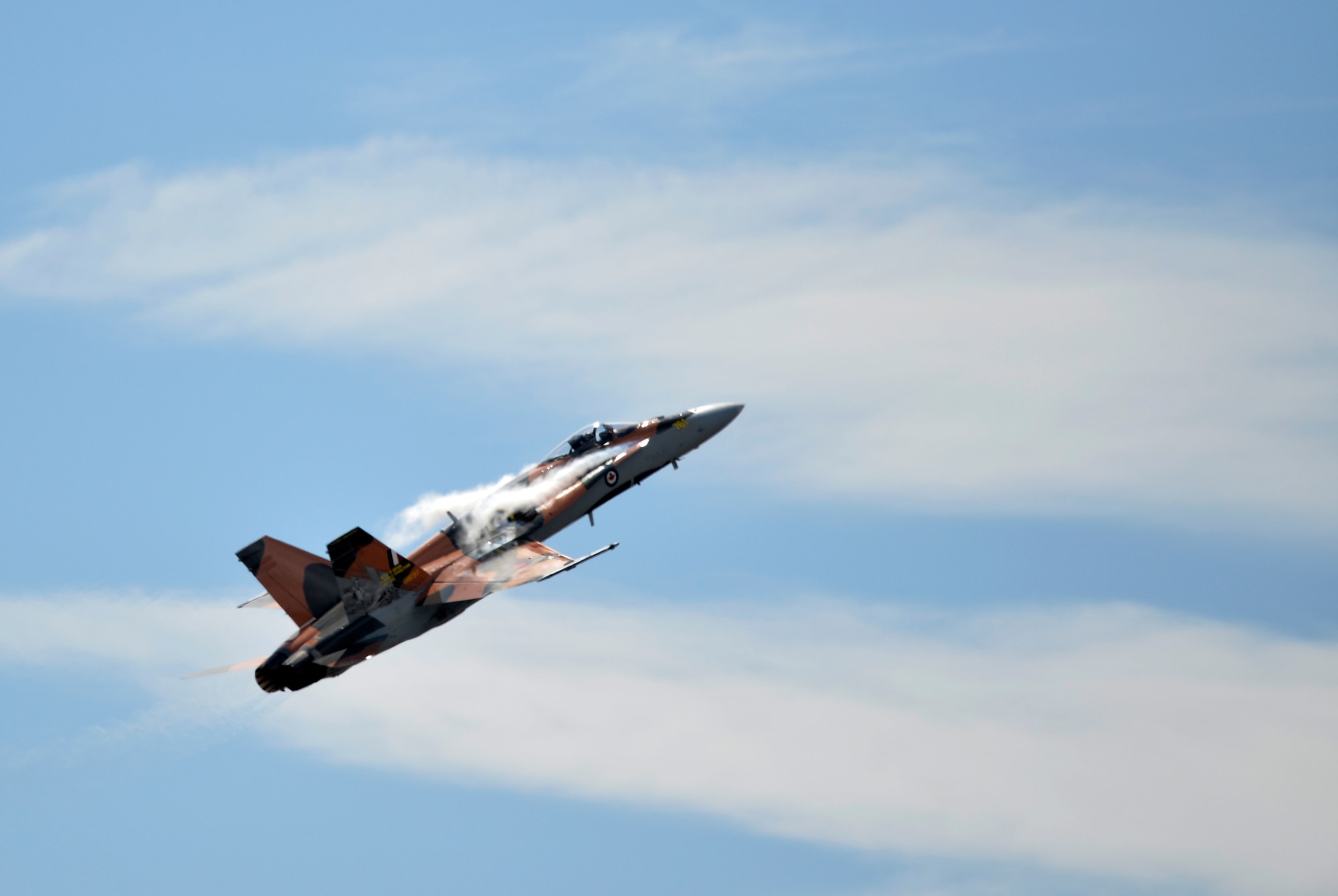 A Canadian Forces CF-18 Hornet performs at the 2015 Lethbridge International Airshow July 24, 2015, in Lethbridge, Alberta province, Canada. The CF-18 performed multiple acrobatics and strafing runs. (U.S. Air Force photo by Airman 1st Class Christian Clausen/Released)