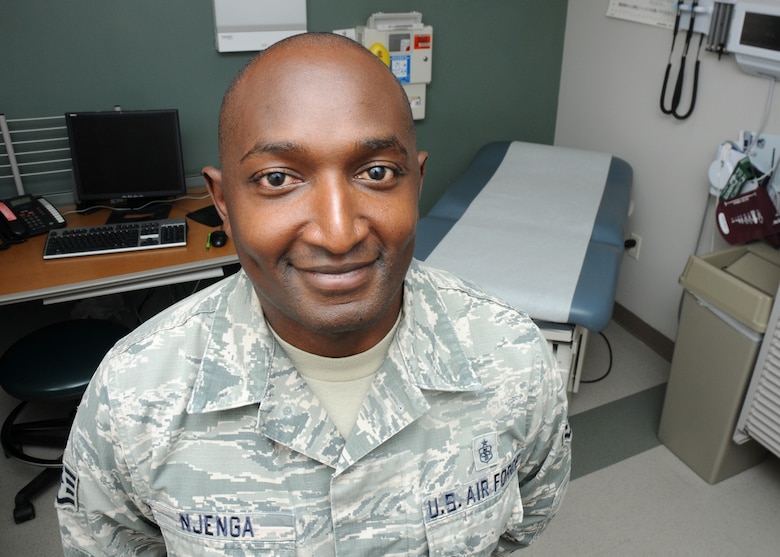 Staff Sgt. Johnson Njenga, 21st Medical Squadron NCO-in charge of Family Health and Kenya native, poses for a photo in an exam room at the base clinic at Schriever  Air Force Base, Colorado, Tuesday, July 28, 2015, for the “I am Schriever” diversity campaign. This campaign aims to recognize the diversity on Schriever and highlight how it makes us stronger. (U.S. Air Force photo/Staff Sgt. Debbie Lockhart)